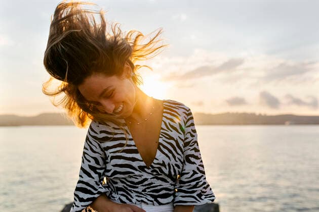 Beautiful woman tossing hair against clear sky model released Symbolfoto MGOF04389