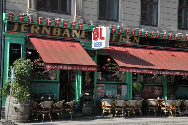Copenhagen Denmark., 27 September 2020 Denmark extended date two week more period closed bar and cafe a1 10.om and people wear protective masks in cafe and rrstuaratn and bar evening seated in cafe and bar and restaurant during covid-10 coronavrius. .