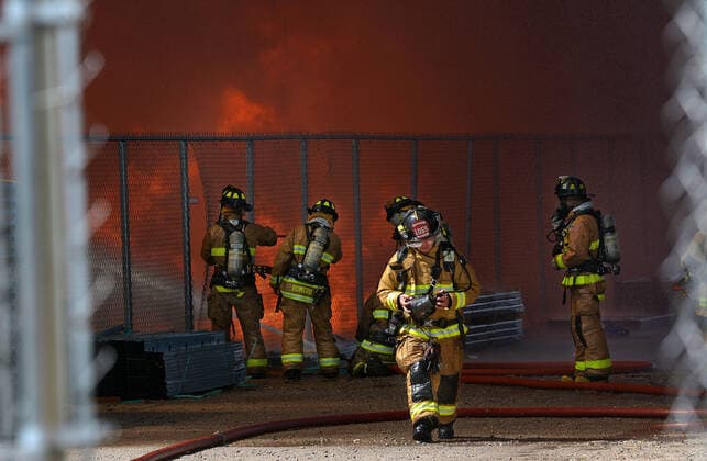 September 29, 2020, Albuquerque, NM, USA: AFR firefighters cut a-way a section of fencing to get into the back of the fire at the Friedman Recycling plant. Tuesday, Sept. 29, 2020. Albuquerque USA - ZUMAab1_ 20200929_zaf_ab1_006 Copyright: xJimxThompsonx