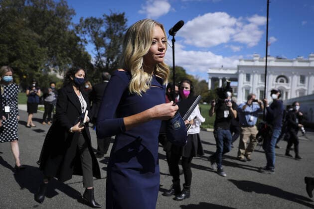 White House press secretary Kayleigh McEnany puts her mask on after talking to members of the media outside the West Wing of the White House on Friday, October 2, 2020 in Washington, DC. President Donald Trump and First Lady Melania Trump have tested positive for coronavirus (COVID-19).  WAX20201002294 OLIVERxCONTRERAS