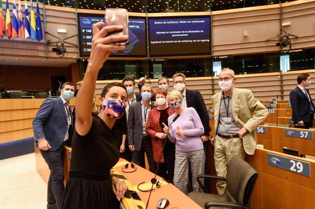 Prime Minister Alexander De Croo and Minister for Developmental Cooperation Meryame Kitir (C) poses with the sp.a s fraction at a plenary session of the Belgian federal chamber, held at the European Parliament, with the debate and vote following the government declaration of the new federal government, Saturday 03 October 2020, in Brussels. After 494 days, Belgium has a new federal government. To allow all chamber members to attend the debate with respect for the social distances rules in the ongoing coronavirus crisis, the session of the chamber was moved from the Belgian federal parliament to the hemisphere of European parliament.  POOLxDIDIERxLEBRUN 05875456