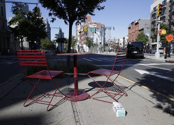Sunlight hits an empty table and chairs in South Williamsburg in New York City on Monday, October 5, 2020. Mayor Bill de Blasio announced his plan to close schools and non-essential businesses again in nine zip codes across Brooklyn and Queens on Sunday due to a spike in Coronavirus infections.  NYP20201005101 JOHNxANGELILLO