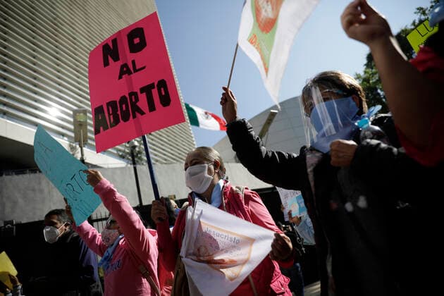 Mexico: Protest against legalization of Abortion Demonstrators of National Front For Family take part during a protest against legalization of abortion in the country, outside the Senate of Mexico, while Senators discuss the modification of a law for the decriminalization or not of abortion in Mexico City, Mexico. **World Rights ** Mexico City Mexico Copyright: MarianaxBae