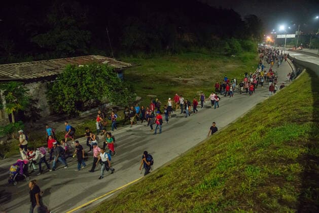 January 15, 2020, San Pedro Sula, Honduras: Migrants walk towards the Guatemalan border at 4am on the first day of their journey to the U.S. border. .Migrants are fleeing from extreme poverty and gang violence, hoping to find a better life in the U.S. They must travel over 3,000 miles through Guatemala and Mexico, often times with nothing but the clothes on their back, to reach the border in Tijuana, Mexico where their fate is undecided. San Pedro Sula Honduras - ZUMAs197 20200115_zab_s197_040 Copyright: xSethxSidneyxBerryx