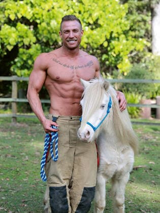 The 2021 Australian Firefighters calendar is here to save 2020. Every October a selection of Australia?s fittest firemen strip off and pose for the Australian Firefighter s Calendar in order to raise money for charity. In the 2021 edition not only do we get to look at some very attractive men, but some adorable animals too; from koalas and kangaroos to rescue kittens and rottweiler puppies. 2019 and early 2020 was a particularly devastating time, and the world grieved with Australia as we suffered through catastrophic bushfires, and an estimated loss of 1 billion animals from our diverse native wildlife. While the fires may have gone, the destroyed bushland has made it impossible for many of the displaced wildlife to return to their n Copyright: xx 40940082 EDITORIAL USE ONLY. NOT FOR USE BY NEWSPAPERS BASED IN THE UK.