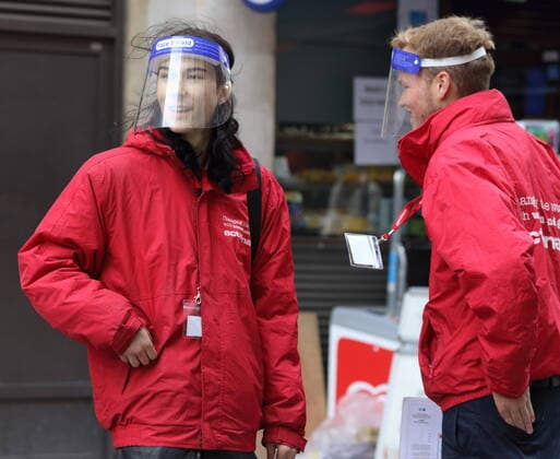 October 14, 2020, London, United Kingdom: Two young charity collectors are seen wearing perspex face shields..Public people are seen wearing facemasks while out shopping in London following prime minister, Boris Johnson s announcement of a new three tier lockdown system because of the increasing cases of coronavirus infections in the UK. London United Kingdom - ZUMAs197 20201014_zaa_s197_394 Copyright: xKeithxMayhewx