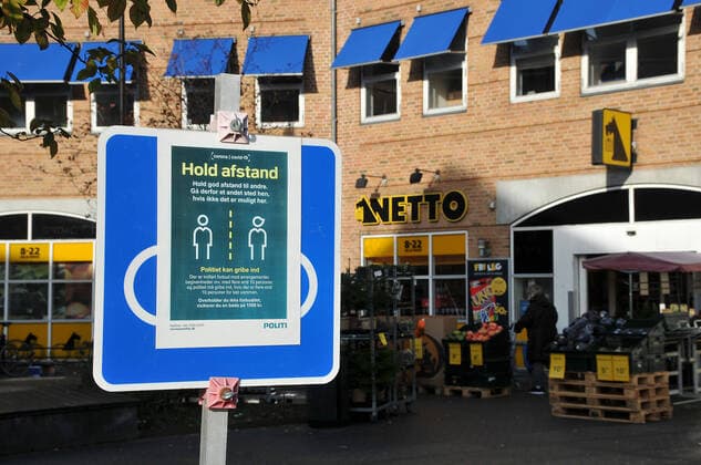 Copenhagen, Denmark,18 October 2020,Polce covid-19 coronavirus pandemic waring for grocerys hoppers and enjoy time for in squiare in Kastrup keep distnce or social distancing in area and in grocey stores. . (Photo..Francis Joseph Dean DeanPictures)