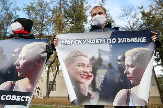 MINSK, BELARUS - OCTOBER 18, 2020: Opposition supporters hold banners with images of a detained member of the Belarusian opposition s coordination council, Maria Kolesnikova, during an unauthorised march in Partizansky Prospekt Street. The messages read: Set them free , Honour, conscience? and We miss your smile . Since the official results of the 2020 Belarusian presidential election results were announced on 9 August, mass protests by opposition activists and supporters have been taking place in cities across Belarus. Natalia Fedosenko TASS  TS0EB4E1