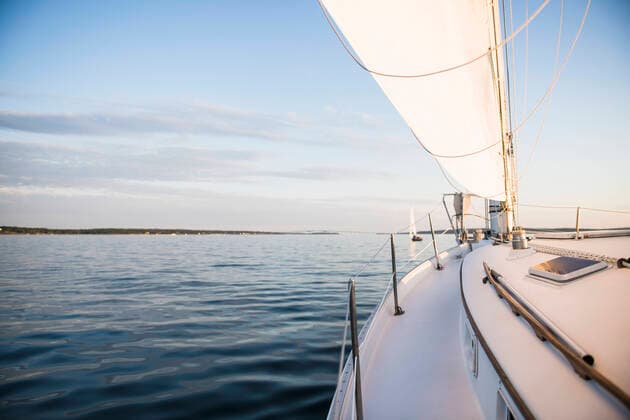 Boat sailing during golden hour summer sunset North Kingstown, RI, United States CR_CABR201016-515083-01