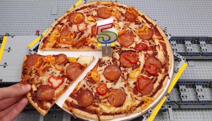 A Lego fan has built a jaw-dropping pizza-making machine entirely from Lego. Canada-based Iouri Petoukhov works with his son Michael to make amazing creations under the name The Brick Wall. Now they have celebrated five years of their projects with an intricate machine that serves up perfect pizzas. It includes mechanisms that dispense tomato sauce, grated cheese, sausage and peppers all while the pizza base revolves to allow even covering of toppings. Iouro tells Cover Images: We have family time when all speak out about what we called crazy ideas and then we write them down on paper and put it on our Brick wall. Making Pizza is an art and love, making Pizza wit Copyright: xx 40952508 EDITORIAL USE ONLY. NOT FOR USE BY NEWSPAPERS BASED IN THE UK.