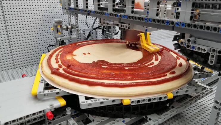 A Lego fan has built a jaw-dropping pizza-making machine entirely from Lego. Canada-based Iouri Petoukhov works with his son Michael to make amazing creations under the name The Brick Wall. Now they have celebrated five years of their projects with an intricate machine that serves up perfect pizzas. It includes mechanisms that dispense tomato sauce, grated cheese, sausage and peppers all while the pizza base revolves to allow even covering of toppings. Iouro tells Cover Images: We have family time when all speak out about what we called crazy ideas and then we write them down on paper and put it on our Brick wall. Making Pizza is an art and love, making Pizza wit Copyright: xx 40952512 EDITORIAL USE ONLY. NOT FOR USE BY NEWSPAPERS BASED IN THE UK.