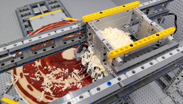 A Lego fan has built a jaw-dropping pizza-making machine entirely from Lego. Canada-based Iouri Petoukhov works with his son Michael to make amazing creations under the name The Brick Wall. Now they have celebrated five years of their projects with an intricate machine that serves up perfect pizzas. It includes mechanisms that dispense tomato sauce, grated cheese, sausage and peppers all while the pizza base revolves to allow even covering of toppings. Iouro tells Cover Images: We have family time when all speak out about what we called crazy ideas and then we write them down on paper and put it on our Brick wall. Making Pizza is an art and love, making Pizza wit Copyright: xx 40952514 EDITORIAL USE ONLY. NOT FOR USE BY NEWSPAPERS BASED IN THE UK.