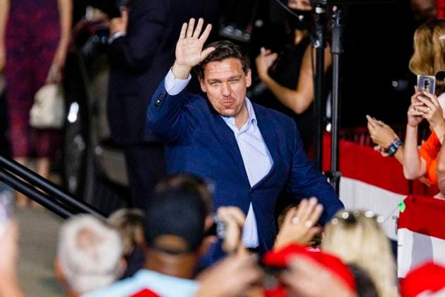 October 23, 2020, Pensacola, FLORIDA, U.S: Florida Governor Ron DeSantis (R) waves to the crowd before President of the United States Donald J. Trump speaks at a campaign rally in Pensacola, Florida on October 23, 2020. President Trump is running for a second term against former Vice President Joe Biden. Pensacola U.S. - ZUMAa14_ 20201023_zaf_a14_038 Copyright: xDanxAndersonx