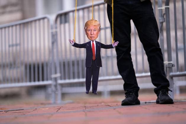 News Themen der Woche KW44 A protester holds a marionette puppet of President Donald Trump as they participate in a demonstration sponsored by various humans rights groups protesting what they say is Trump s inappropriate relationships with autocrats and his manipulation of the Republican Party, at the Trump Tower in Washington, DC on Tuesday, October 27, 2020.  WAP202010273306 KEVINxDIETSCH
