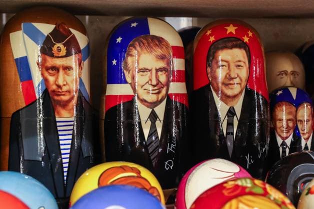 ST PETERSBURG, RUSSIA - OCTOBER 28, 2020: Pictured in this illustration are Russian dolls with the likenesses of Russia s President Vladimir Putin, US President Donald Trump and China s President Xi Jinping (L-R), for sale in a gift shop. Alexander Demianchuk TASS  TS0EC478