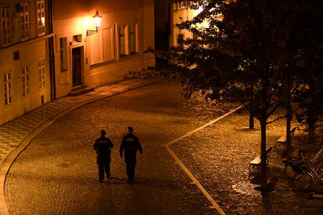 Curfew in Czechia from 21:00 to 04:59. During the night, people may go to and from work, make urgent trips to a doctor and walk the dog outside, but only within up to a half-kilometre distance from their homes. People may also walk a dog outside, but not get more than half a kilometre from their home. Policemen at the city center of Prague, Czech Republic, October 28, 2020. (CTKxPhoto OndrejxDeml) CTKPhotoP202010281166001 