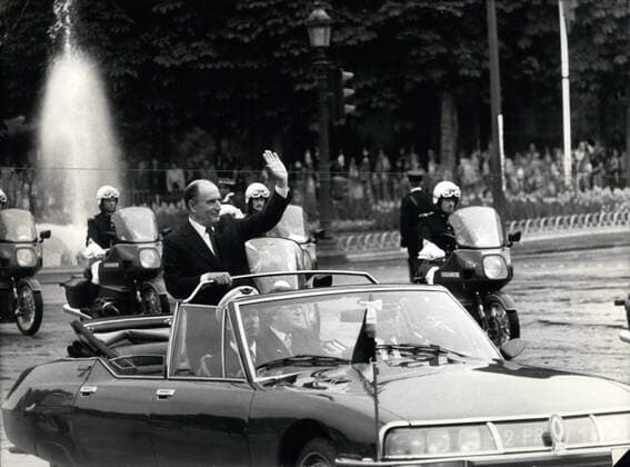 May 21, 1981 - Paris, France - Newly-elected French President FRANCOIS MITTERAND (1916 - 1996) is followed by motorcycle police officers as he rides and waves from a convertible during a procession down the Champs Elysees after his inauguration as President. Paris France - ZUMAk09_ 19810521_jes_k09_042 Copyright: xKEYSTONExPicturesx