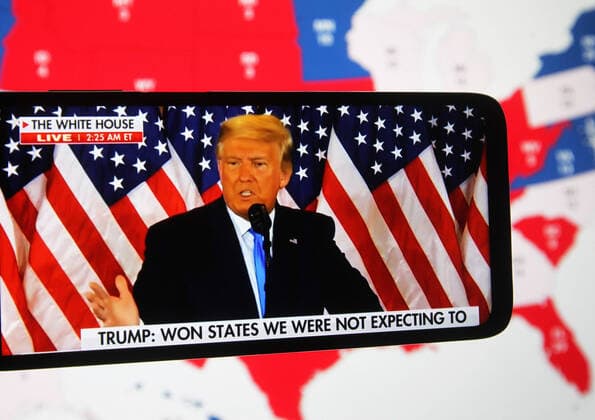 November 4, 2020, Ukraine: In this photo illustration the US President Donald Trump speaks after early results of the U.S. presidential election in the East Room of the White House in Washington, US on a video displayed on a smartphone screen. Ukraine - ZUMAs197 20201104_zaa_s197_041 Copyright: xPavloxGoncharx