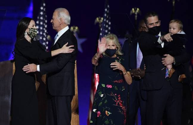 President-elect Joe Biden hugs his daughter Ashley Blazer Biden (L) as his wife Dr. Jill Biden, son Hunter Biden and his grandson wave as they celebrate onstage after Biden defeated Republican President Donald Trump in the 2020 presidential election, in Wilmington, Delaware on Saturday, November 7, 2020. After four additional days of vote counting, Biden has pulled ahead winning several swing states by a narrow margin.  WIL20201107541 PATxBENIC