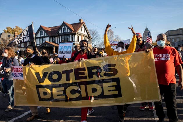 November 7, 2020, Detroit, United States: Demonstrators hold a Voters Decide banner highlighting the win for Biden declared earlier today..Hundreds of people turned out for the Michigan Fights Back! Protect the Vote Rally and March that began and ended at the Detroit Department of Elections. This protest was in support of Black Lives matter, the LGBTQ community and the results of the 2020 presidential election and also against police brutality and President Donald Trump. Detroit United States - ZUMAs197 20201107_zaa_s197_242 Copyright: xStephenxZennerx