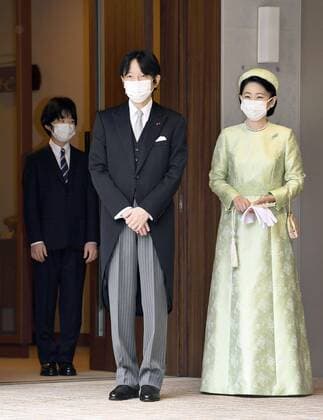 Japan Crown Prince Fumihito formally declared 1st in line to throne Japanese Prince Hisahito (L) sees off his parents Crown Prince Fumihito and Crown Princess Kiko at their residence in the Akasaka Estate in Tokyo on Nov. 8, 2020, before the couple departs for a ceremony at the Imperial Palace. Crown Prince Fumihito was formally declared first in line to the Chrysanthemum Throne at the ceremony, part of the Rikkoshi no rei rituals. (Pool photo) 