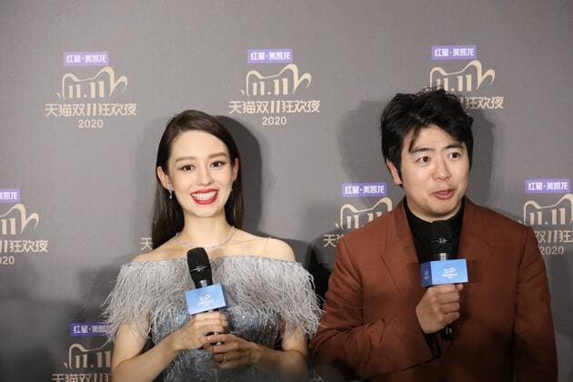Chinese concert pianist Lang Lang, right, and his wife Gina Alice Redlinger, left, are interviewed prior to the 2020 Tmall Double 11 Gala, which is held to celebrate the Double 11, a shopping festival established by Alibaba Group, Shanghai, China, 10 November 2020.