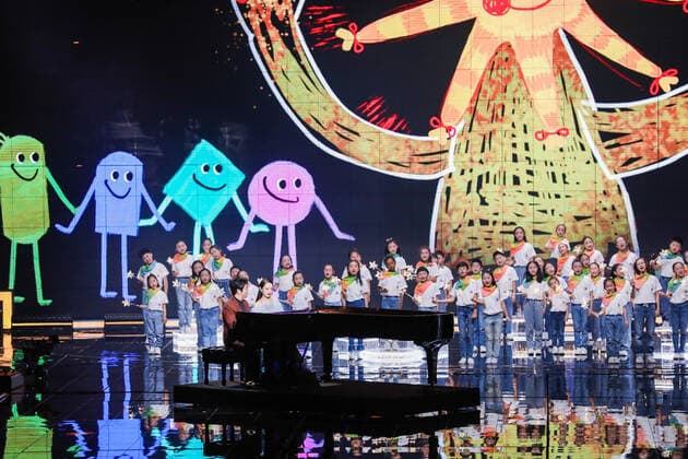 Chinese concert pianist Lang Lang, front left, and his wife Gina Alice Redlinger, front right, perform during the 2020 Tmall Double 11 Gala held by Alibaba Group in Shanghai, China, 10 November 2020.