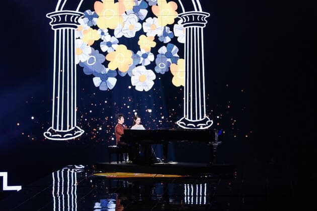 Chinese concert pianist Lang Lang, left, and his wife Gina Alice Redlinger, right, perform during the 2020 Tmall Double 11 Gala held by Alibaba Group in Shanghai, China, 10 November 2020.