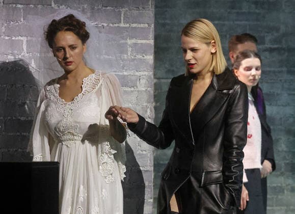 MOSCOW, RUSSIA - NOVEMBER 10, 2020: Actresses Maria Shumakova and Alexandra Rebenok (L-R front) in a scene from a theater production of Fyodor Dostoyevsky s novel Demons staged by director Konstantin Bogomolov at the Palace on the Yauza theater and concert hall. Sergei Fadeichev TASS  TS0EDC82