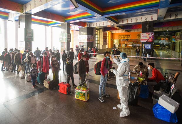 NEW DELHI, INDIA - NOVEMBER 23: Passengers queue to give their swab sample for coronavirus test, at New Delhi Railway Station (NDLS), on November 23, 2020 in New Delhi, India. (Photo by Amal KS Hindustan Times) Medical Team Conducts COVID-19 Coronavirus Test