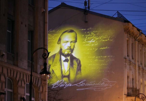 ST PETERSBURG, RUSSIA - NOVEMBER 24, 2020: A projection of Russian writer Fyodor Dosyoevsky s portrait lights up the firewall of a house in Kuznechny Lane where he spent the last years of his life. It is the first mural projection in the historical area of the city. Alexander Demianchuk TASS  TS0EF8D6