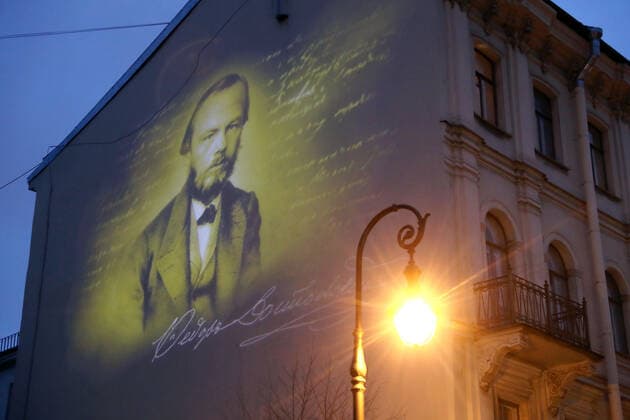 ST PETERSBURG, RUSSIA - NOVEMBER 24, 2020: A projection of Russian writer Fyodor Dosyoevsky s portrait lights up the firewall of a house in Kuznechny Lane where he spent the last years of his life. It is the first mural projection in the historical area of the city. Alexander Demianchuk TASS  TS0EF8D9