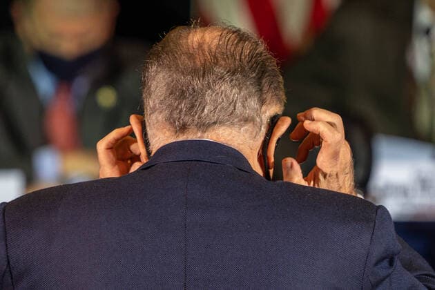 Rudy Guliani, President Trump attorney, adjusts his mask prior to delivering remarks at a Pennsylvania state hearing on election issues, in Gettysburg, Pennsylvania on Wednesday, November 25, 2020.  WAP20201125511 KENxCEDENO