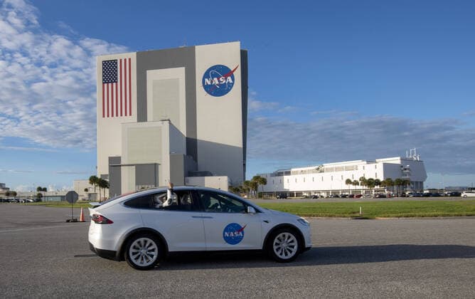 An astronaut waves as they ride in a Tesla Model X to Complex 39A at the Kennedy Space Center, Florida, on Sunday, November 15, 2020. Noguchi will serve as Mission Specialist on the first operational crew launched to the International Space Station.  POY2020NF053 PATxBENIC