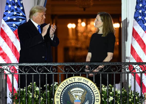 President Donald Trump applauds Judge Amy Coney Barrett after taking her Constitutional oath to become a Supreme Court justice at the White House in Washington, DC, on Monday, October 26, 2020. The Senate confirmed Barrett, 52-48, to be the next Supreme Court Justice, replacing the late Ruth Bader Ginsburg.  POY2020DC187 KEVINxDIETSCH