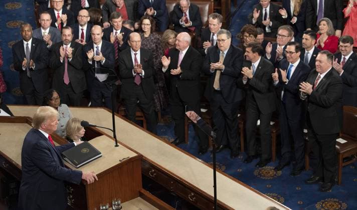 The White House Cabinet members stand to applaud as President Donald Trump delivers his State of the Union address during a joint session of Congress in the House Chamber of the U.S. Capitol in Washington, DC, on Tuesday, February 4, 2020. At right is Secretary of State Mike Pompeo. The Senate is expected to meet later today, Wednesday, February 5, 2020, to acquit at the conclusion of the Impeachment Trial of the president.  POY2020DC003 PATxBENIC