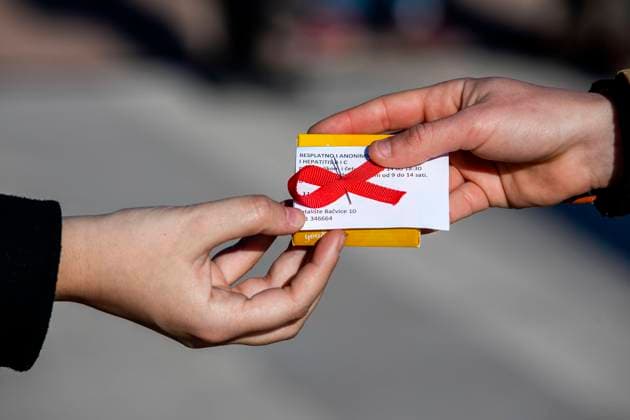 PXL_World AIDS Day On the occasion of the World AIDS Day, volunteers from the Youth Aid Association HELP shared red ribbons and condoms and also educated citizens about the importance of HIV testing, in Split, Croatia ,on Dec 01, 2020. MiroslavxLelas PIXSELL