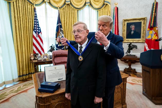 December 3, 2020, Washington, District of Columbia, USA: United States President Donald J. Trump presents the Medal of Freedom to Lou Holtz, in the in the Oval Office of the White House in Washington, DC, Thursday, Dec, 3, 2020. Afterwards he makes remark about the election and the Attorney General Washington USA - ZUMAs152 20201203_zaa_s152_004 Copyright: xDougxMillsx