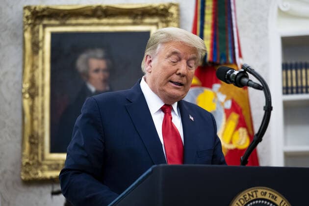 President Donald Trump delivers remarks before presenting the Medal of Freedom to Lou Holtz in the Oval Office at the White House in Washington, DC on Thursday, December 3, 2020. Holtz, the hall of fame college football coach, had a 34 year coaching career that included winning the 1988 national championship with the University of Notre Dame. Holtz coached six different programs to bowl games and four different teams to top 20 final rankings. Pool photo by Doug Mills  WAX20201203338 DOUGxMILLS