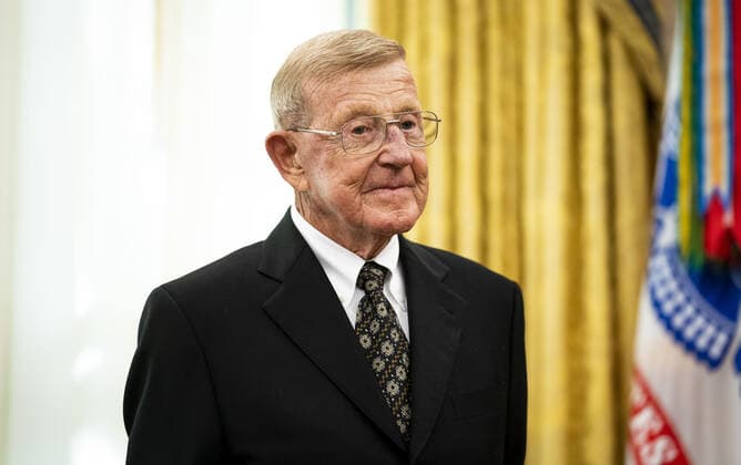 Former college football coach Lou Holtz stands before President Trump presented him with a Medal of Freedom, in the Oval Office at the White House in Washington, DC on Thursday, December 3, 2020. Holtz, the hall of fame college football coach, had a 34 year coaching career that included winning the 1988 national championship with the University of Notre Dame. Holtz coached six different programs to bowl games and four different teams to top 20 final rankings. Pool photo by Doug Mills  WAX20201203341 DOUGxMILLS