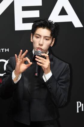 Chinese rapper, dancer and singer Wang Ziyi, also known as BOOGIE, shows up in black suit at the red carpet for the GQ Men of The Year 2020, Shanghai, China, 4 December 2020.