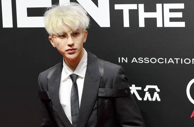 Chinese singer-songwriter, dancer, actor and rapper Cai Xukun, better known by the mononym Kun, shows up in black suit with white hair, showing off his elegance at the red carpet for the GQ Men of The Year 2020, Shanghai, China, 4 December 2020.