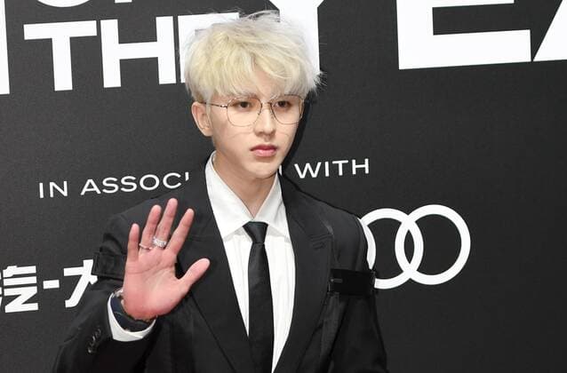 Chinese singer-songwriter, dancer, actor and rapper Cai Xukun, better known by the mononym Kun, shows up in black suit with white hair, showing off his elegance at the red carpet for the GQ Men of The Year 2020, Shanghai, China, 4 December 2020.