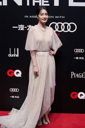 Chinese actress Li Qin, also known as Sweet Li, shows up in white dress, showing off her elegance at the red carpet for the GQ Men of The Year 2020, Shanghai, China, 4 December 2020.