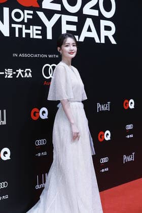 December 4, 2020, Shanghai, China: Chinese actress Li Qin, also known as Sweet Li, shows up in white dress, showing off her elegance at the red carpet for the GQ Men of The Year 2020, Shanghai, China, 4 December 2020.
