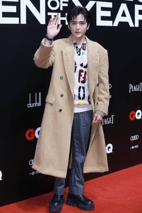 Chinese actor Zhang Xincheng, also known by his English name Steven Zhang, shows up in brown coat, showing her gentle and elegance at the red carpet for the GQ Men of The Year 2020, Shanghai, China, 4 December 2020.