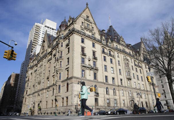 Pedestrians walk by The Dakota, the home of John Lennon, on the eve of the 40th anniversary of the night the Beatles legend was shot and killed by Mark Chapman in New York City on Monday. December 7, 2020. Strawberry Fields is a 2.5-acre landscaped section in New York City s Central Park that is dedicated to the memory of the former Beatles member.  NYP20201207104 JohnxAngelillo