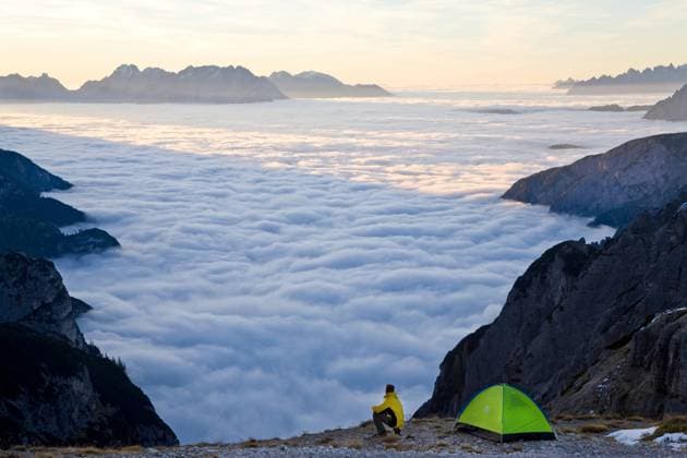 Man and tent above the clouds, Trentino-Alto Adige, South Tyrol in Bolzano district, Alta Pusteria, Hochpustertal,Sexten Dolomites, Italy Man and tent above the clouds, Trentino-Alto Adige, South Tyrol in Bolzano district, Alta Pusteria, Hochpustertal,Sexten Dolomites, Italy  Man and tent above the clouds, Trentino-Alto Adige, South Tyrol in Bolzano district, Alta Pusteria, Hochpustertal,Sexten Dolomites, Italy