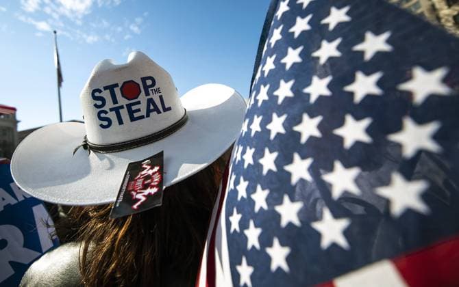 Trump supporters rally on the Pennsylvania Ave. in Washington, DC on Saturday, December 12, 2020. Large groups of supporters of President Donald Trump are marching on the the Nation s capital as they allege, without evidence, that President-elect Joe Biden stole the U.S. election from Donald Trump.  WAP20201212343 KEVINxDIETSCH
