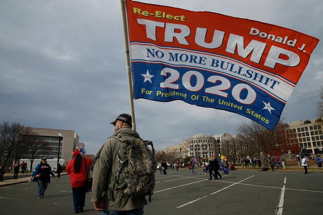 December 12, 2020, Washington, D.C, United States: President Trump™s supporters march with placards and banners on Pennsylvania Avenue towards Freedom Plaza in Washington DC..Backers continue to support the President™s unproven claims of massive voter fraud and electoral irregularities. Following the November MAGA (Make America Great Again) rally in Washington, Women for America First, a conservative organization, has filed for another permit to rally in support of President Trump, just two days before the electors from each state are to vote for their candidate. Washington United States - ZUMAs197 20201212_zaa_s197_292 Copyright: xJohnxLamparskix